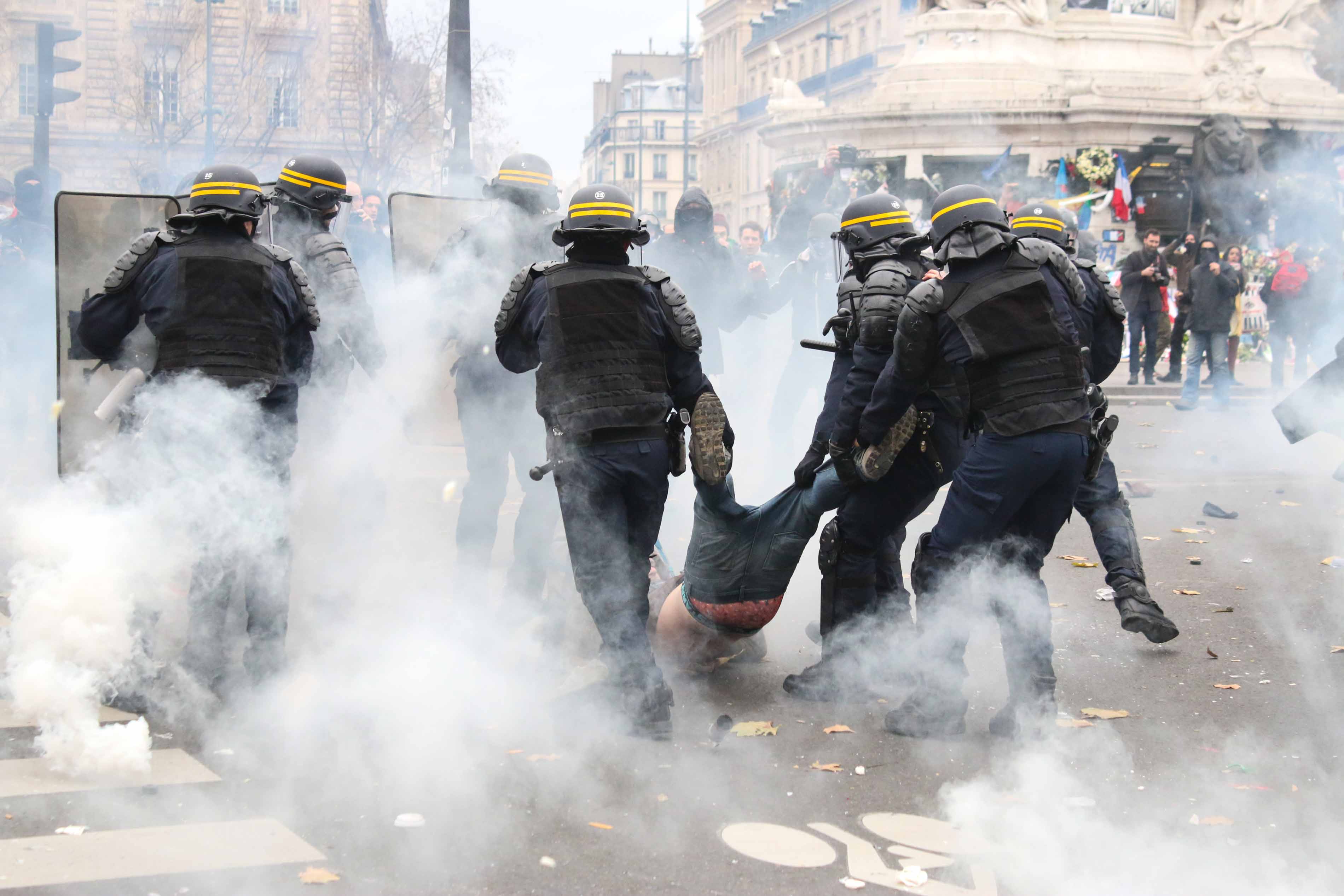 A man is violently arrested Place de la Republique, in Paris, France, during COP21 protests, November 29, 2015. The protests, forbidden under France's emergency law, were met by heavy police force leading to escalating tensions.
