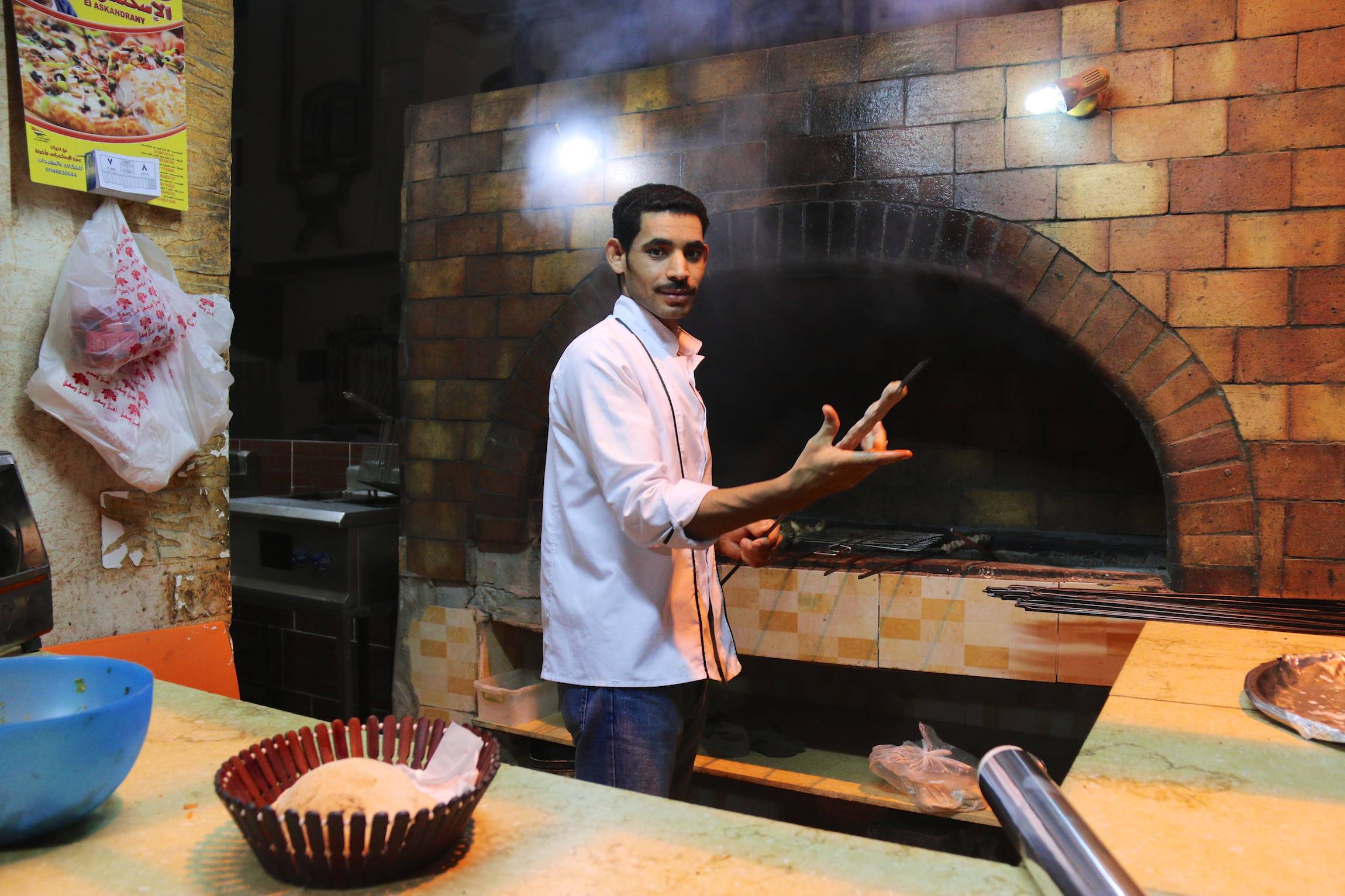An Egyptian cook poses for a portrait as he prepares dinner for guests in El Quseir, Egypt, Jan. 8, 2014.
